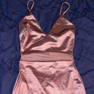 Rose gold tight fitting dress.